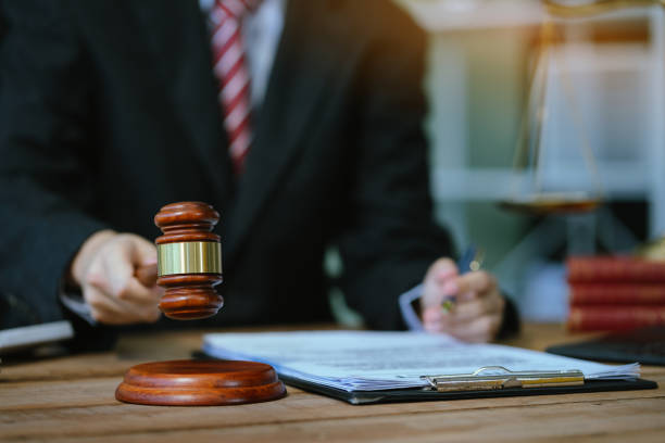 istock Serious pensive lawyer working at desk in office. 2156156782