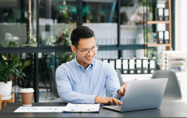 istock Mature business man executive manager looking at laptop watching online webinar training or having virtual meeting video conference 2156156971