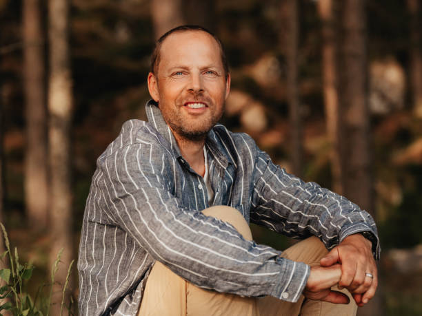 istock Handsome real man outdoors in nature in forest woods in summer 2156157953