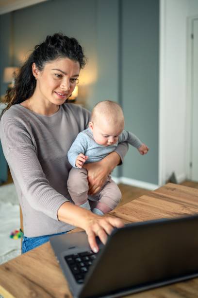 istock Mother and baby working together. 2156158108