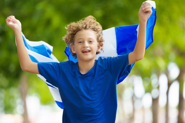 istock Child running with Scotland flag 2156159901