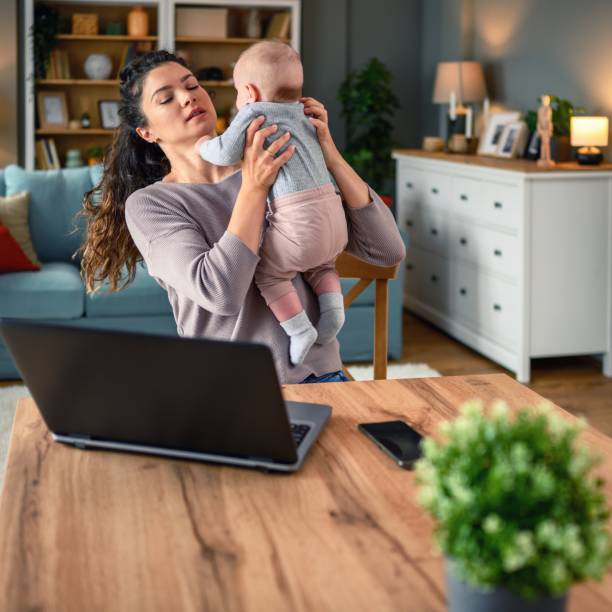 istock Mother and baby working together. 2156160625