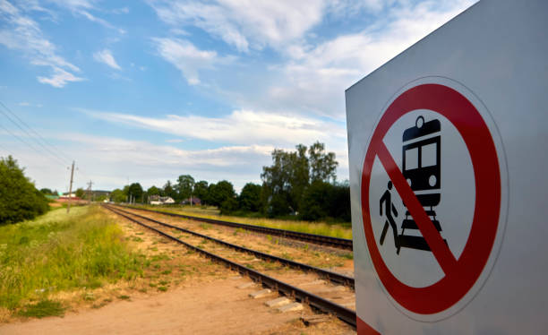 istock Warning Sign Prohibiting Access to Railway Tracks Under the Bright Sunlight 2156160929