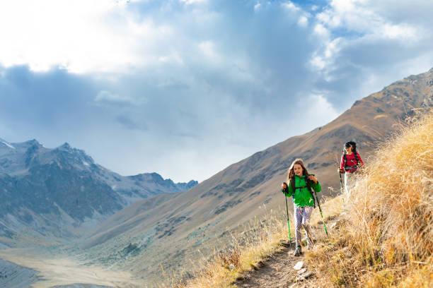 istock Mother and daughter hiking in mountain 2156161000