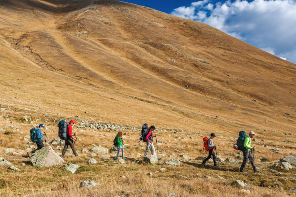 istock Group of tourists hiking in mountain 2156161678