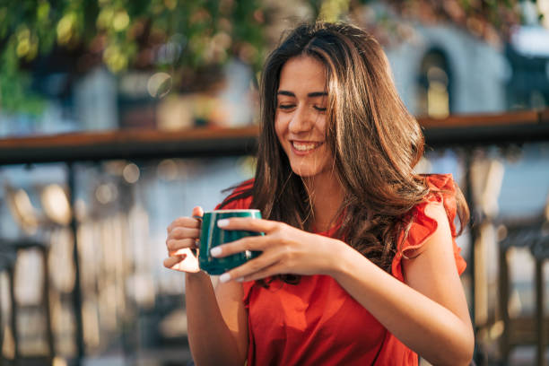 istock young woman enjoy in cafe, sunny day 2156162801