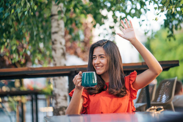 istock young woman enjoy in cafe, sunny day 2156163150