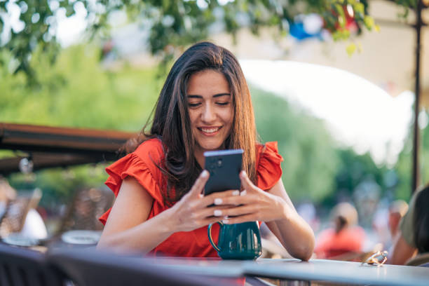 istock young woman enjoy in cafe, sunny day 2156163209