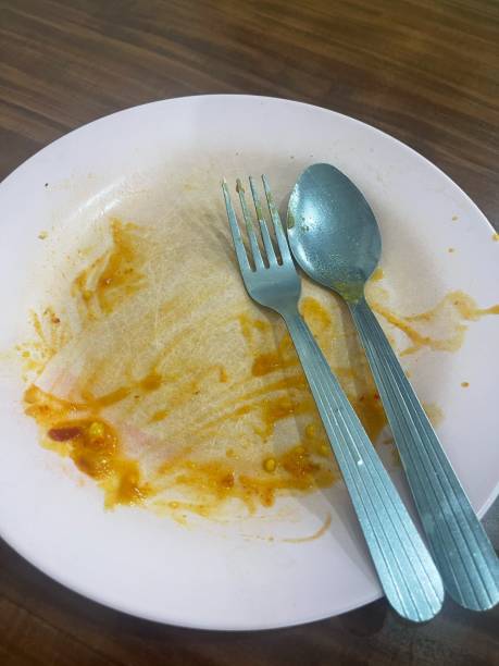 istock Empty plate with spoon and fork after eating Roti Canai 2156167959