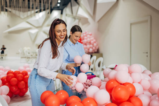 istock Two women enjoy their creative work, making decorations for celebrations 2156168281