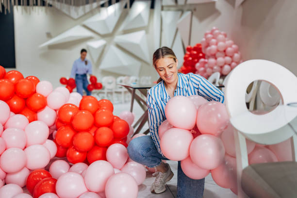 istock Two decorators have blown up many balloons to make decorations for the party 2156168404