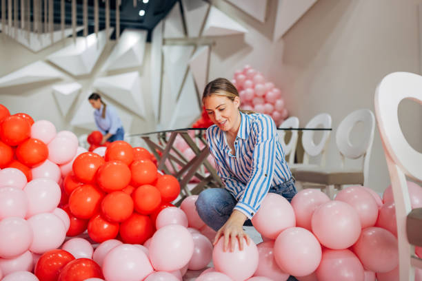 istock Two decorators are making balloon decorations for a party 2156168423