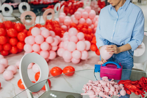 istock An unrecognizable decorator uses an air pump to inflate balloons and create the perfect birthday decoration 2156170188