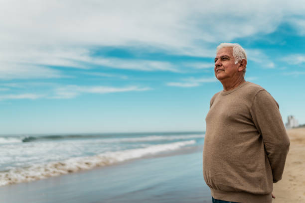 istock Senior man contemplating at beach 2156170624