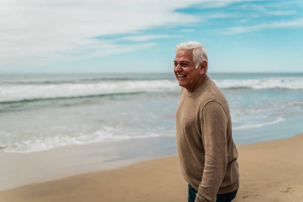 istock Happy senior man relaxing and admiring the beach 2156170638