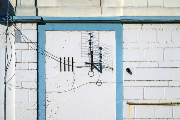 istock Old Tv aerial antenna casting shadow on the wall 2156171112
