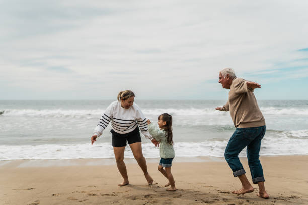 istock Family running on the beach 2156171301