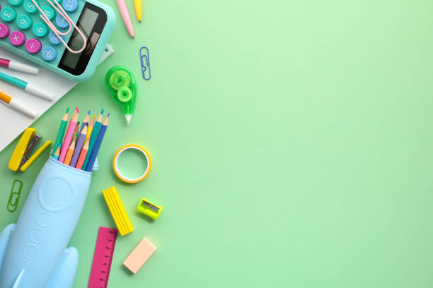 istock Back to school concept. Banner design with rocket shaped pencil case with school supplies, calculator, ruler, pencils on pastel green background. Flat lay, top view, copy space. 2156171474