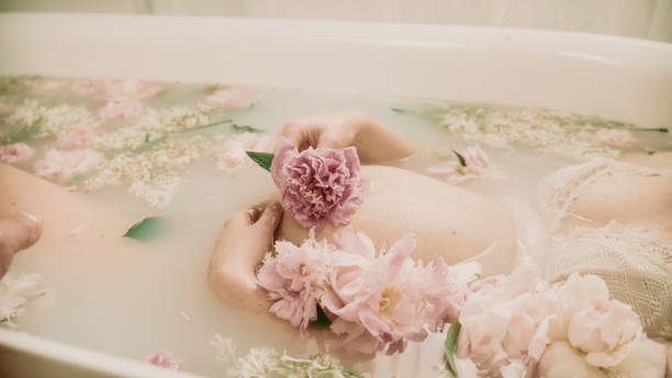 istock Bathing during pregnancy in pink flowers - Peonies. 2156171753