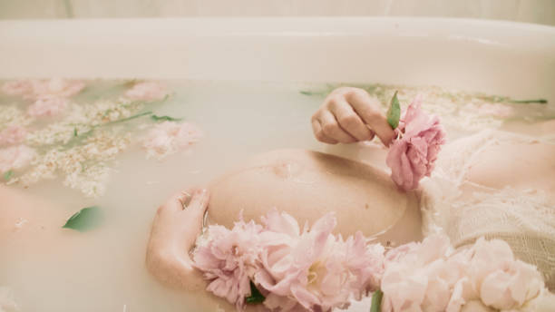 istock Bathing during pregnancy in pink flowers - Peonies. 2156171754