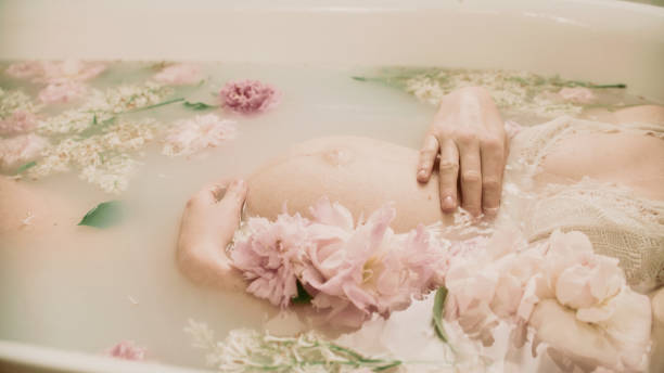 istock Bathing during pregnancy in pink flowers - Peonies. 2156171758