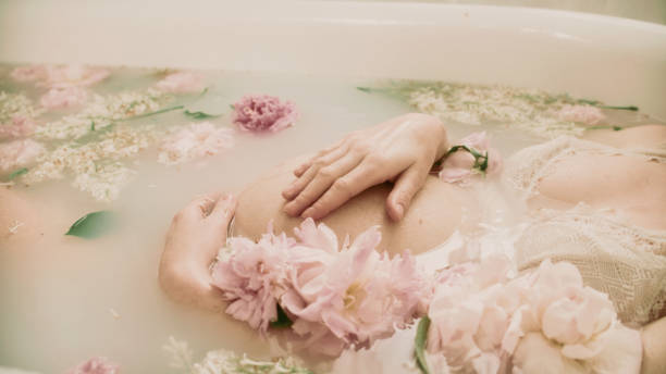 istock Bathing during pregnancy in pink flowers - Peonies. 2156171759