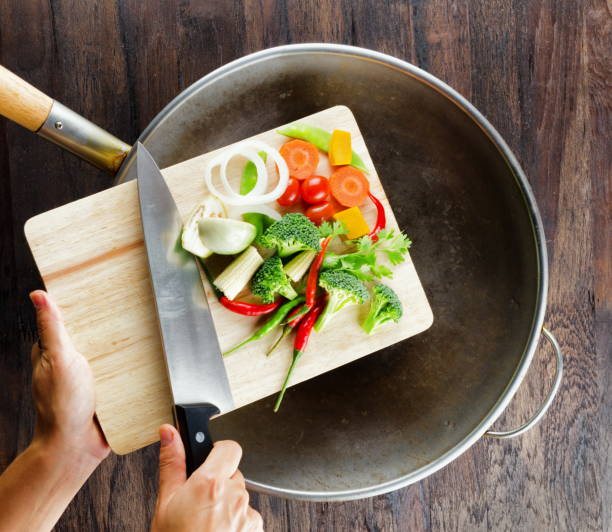 istock Closeup preparig, cuting organic vegetables. Studio shot. 2156176545