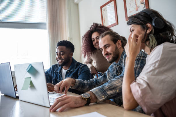 istock A group of students, huddled over textbooks and notes, diligently prepare for an upcoming exam. 2156177171
