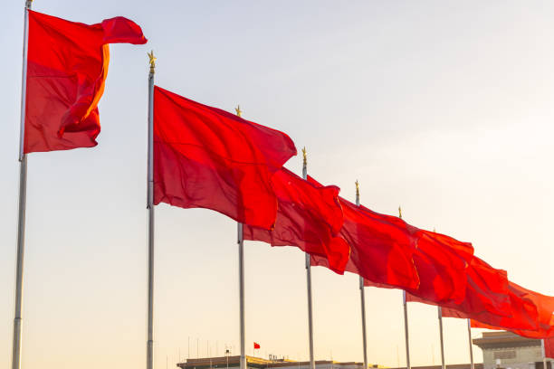 istock A row of red flags blowing in the wind in Beijing,China 2156179300