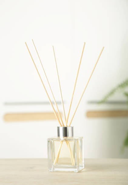 istock Aroma sticks in glass bottle. Aroma diffuser on table in room. Vertical photo 2156179565