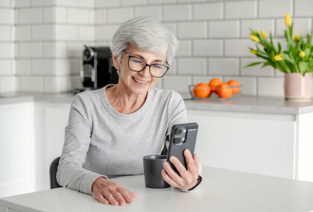 istock Cute Senora Video Chatting On Phone 2156179736