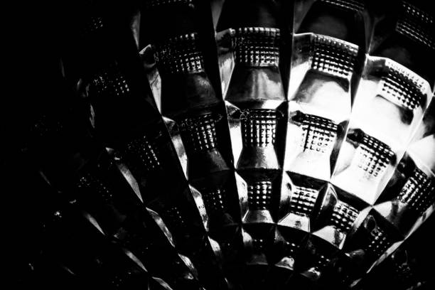 A closeup towards a piece of glass on a dome which looks like a headlight