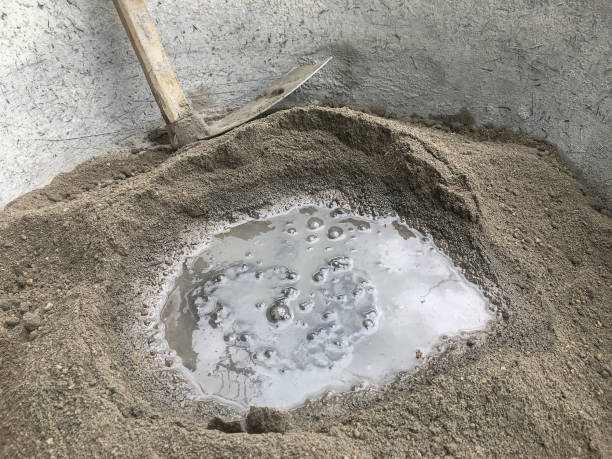 istock Construction concept, The mixing of stone, Cement, Sand together to make a strong concrete building 2156185332