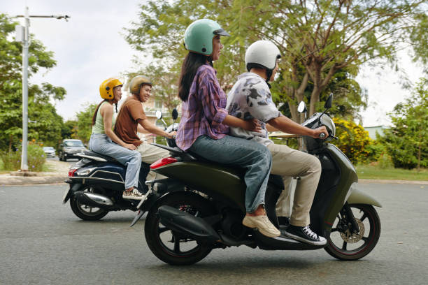 istock Friends Riding Motorbikes and Laughing Together 2156185509
