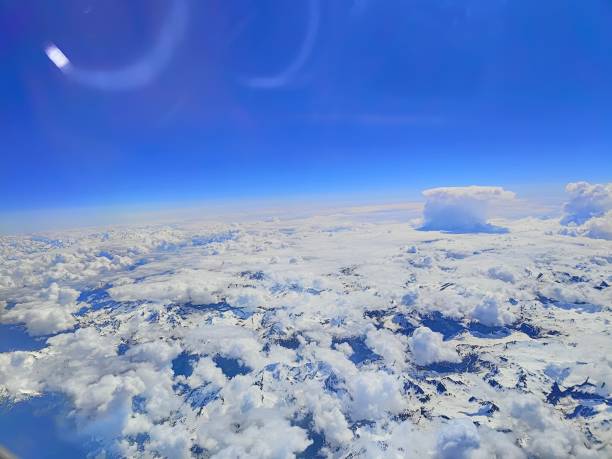 Free Stock Photo of Aerial view of snowy mountain capped with clouds ...