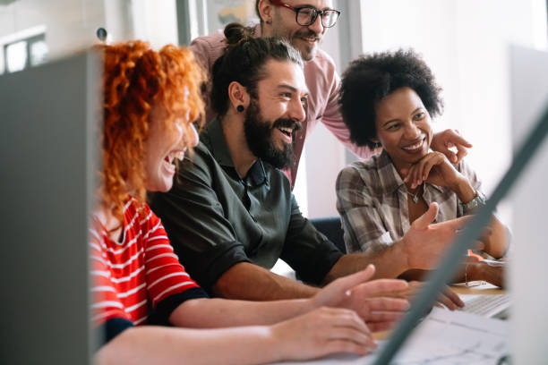 istock Group of business people and software developers working as a team in office 2156189328