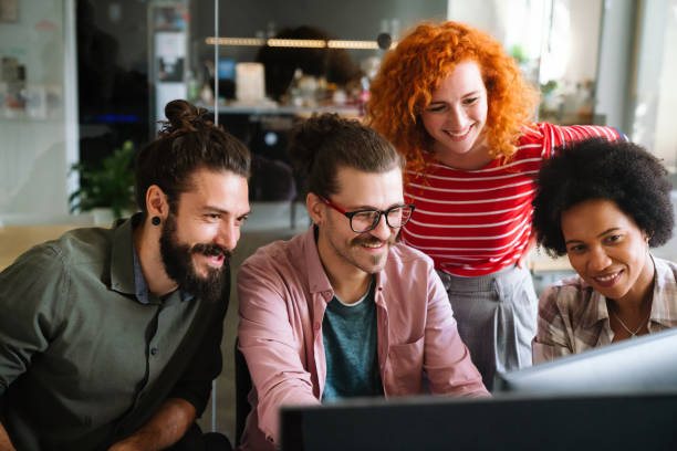 istock Group of business people and software developers working as a team in office 2156189410