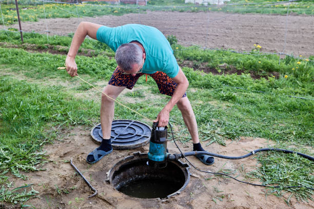 istock Pumping sewage from septic tank using submersible wastewater pump. 2156191160