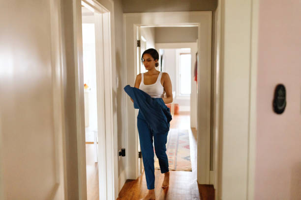 istock Healthcare provider  getting dressed for work in the morning 2156195634