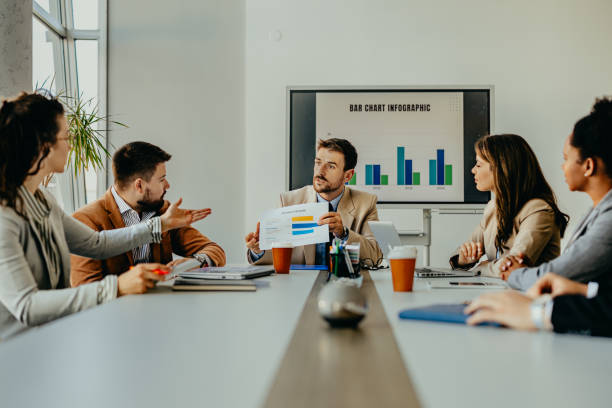 istock A modern business meeting with data analysis and discussion 2156197568