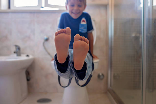 istock Cute child, boy, sitting on the toilet 2156201415