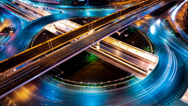 istock Expressway top view, Road traffic an important infrastructure, Drone aerial view fly in circle, traffic transportation, Public transport or commuter city life concept of economic and energ, transport. 2156201436