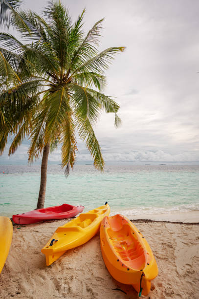 istock Colorful kayaks on the tropical beach 2156201710