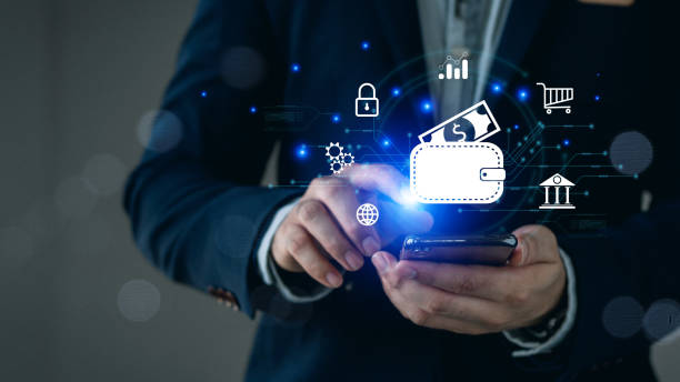 istock Businessman Hand Using Mobile Phone to Connect Digital Wallet. Mobile banking, online finance, e-commerce, Smart, E-wallet, Financial and Economy. 2156202718