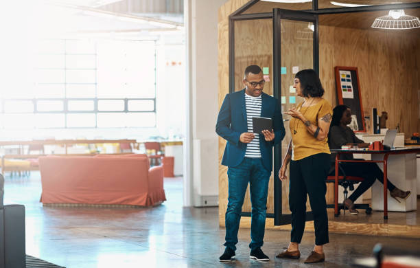 istock Discussion, tablet and business people in office for planning, online networking and internet. Creative agency, teamwork and man and woman on digital tech for research project, website and consulting 2156204755