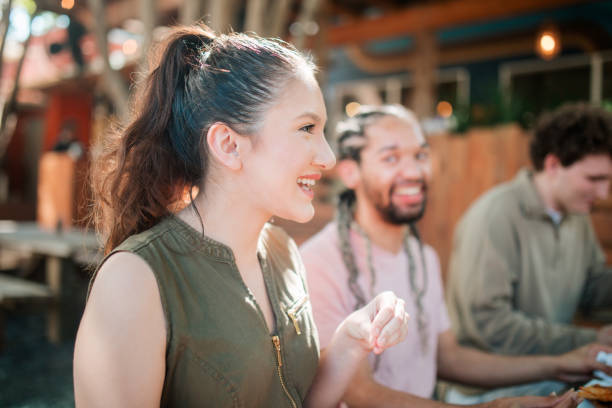 istock Friend Group Enjoying Meal Togeter 2156205710