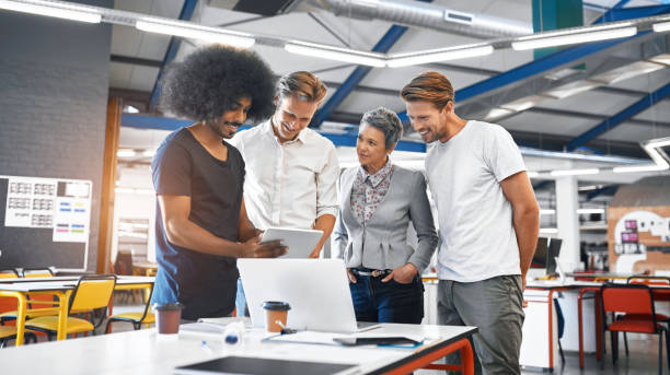 istock Team, people and tablet with meeting in office for planning, ideas or collaboration as web design of agency growth. Smile, woman and men on digital tech for research, brainstorming or media project 2156206175
