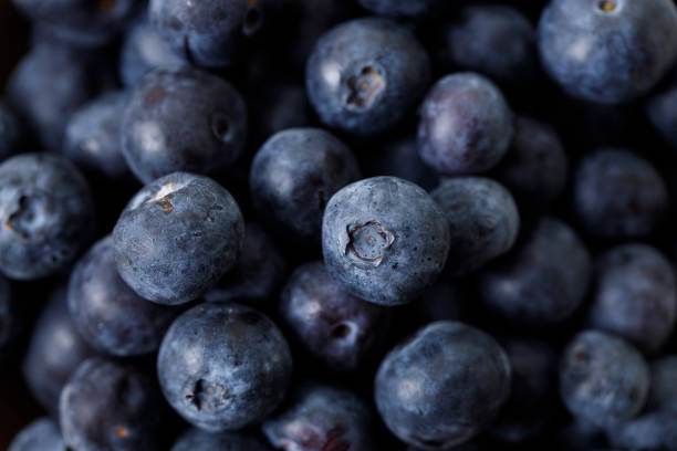 istock Ripe organic blueberries on white wooden table background. Selective focus. 2156207173