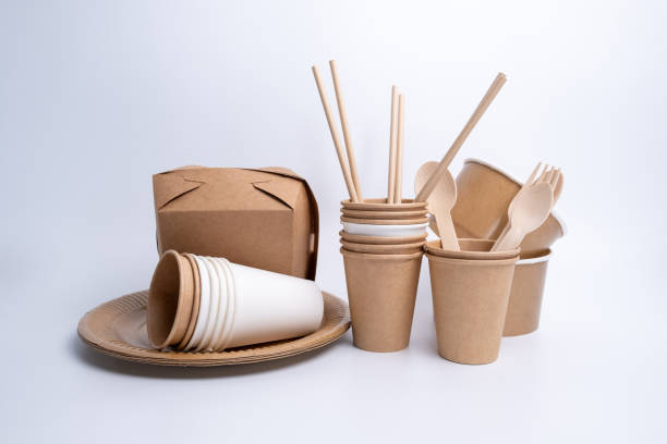 istock Kraft paper tableware: cups, food boxes, isolated on a light background. A set of various disposable tableware. Recycling and zero waste concept. Mock up 2156207629
