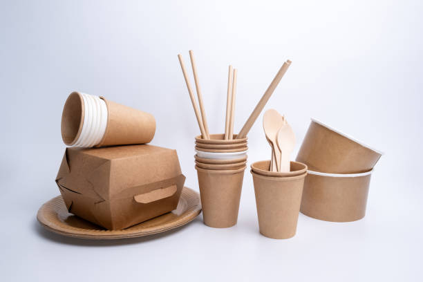 istock Kraft paper tableware: cups, food boxes, isolated on a light background. A set of various disposable tableware. Recycling and zero waste concept. Mock up 2156207633